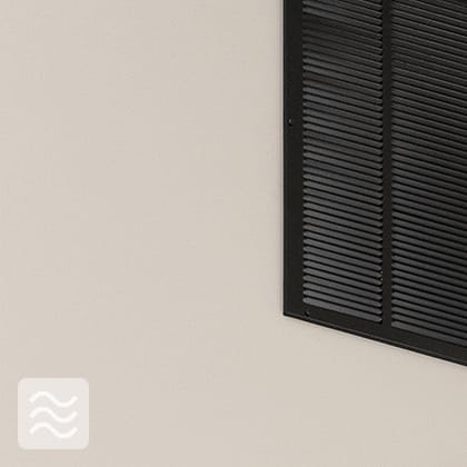 Three black, round ventilation nozzles mounted in a long, black profile under the ceiling. A white WiFi access point is also visible.