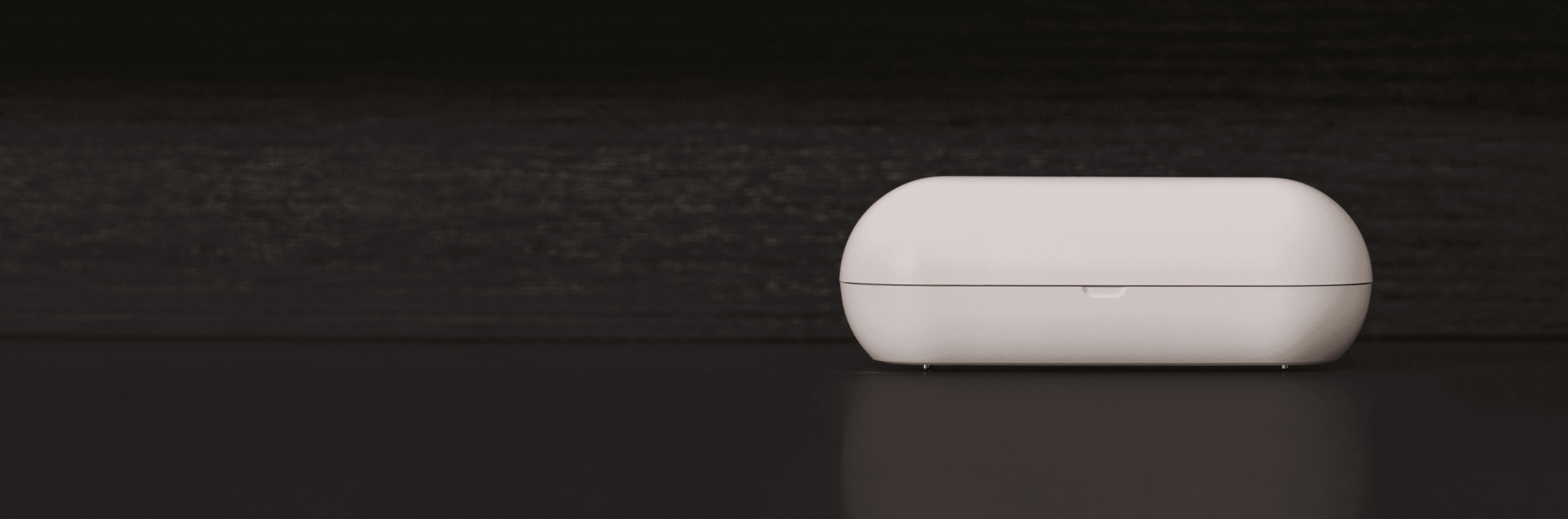 A Hombee OS device on a dark countertop.