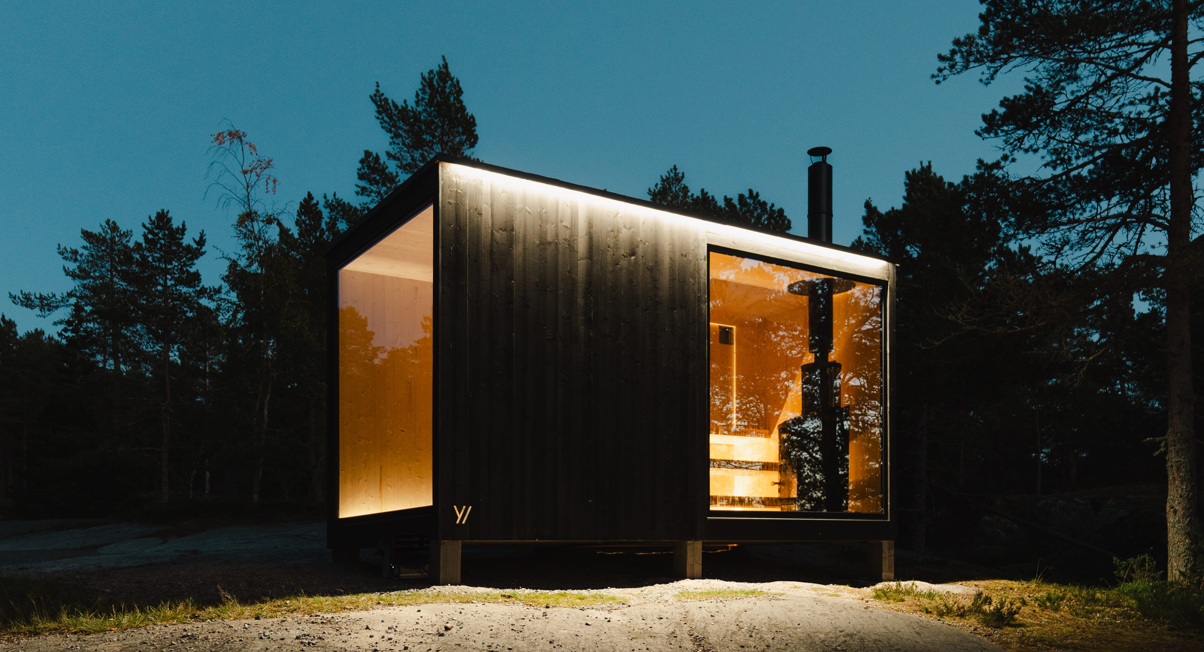 A modern hotel with a wooden facade in the mountains