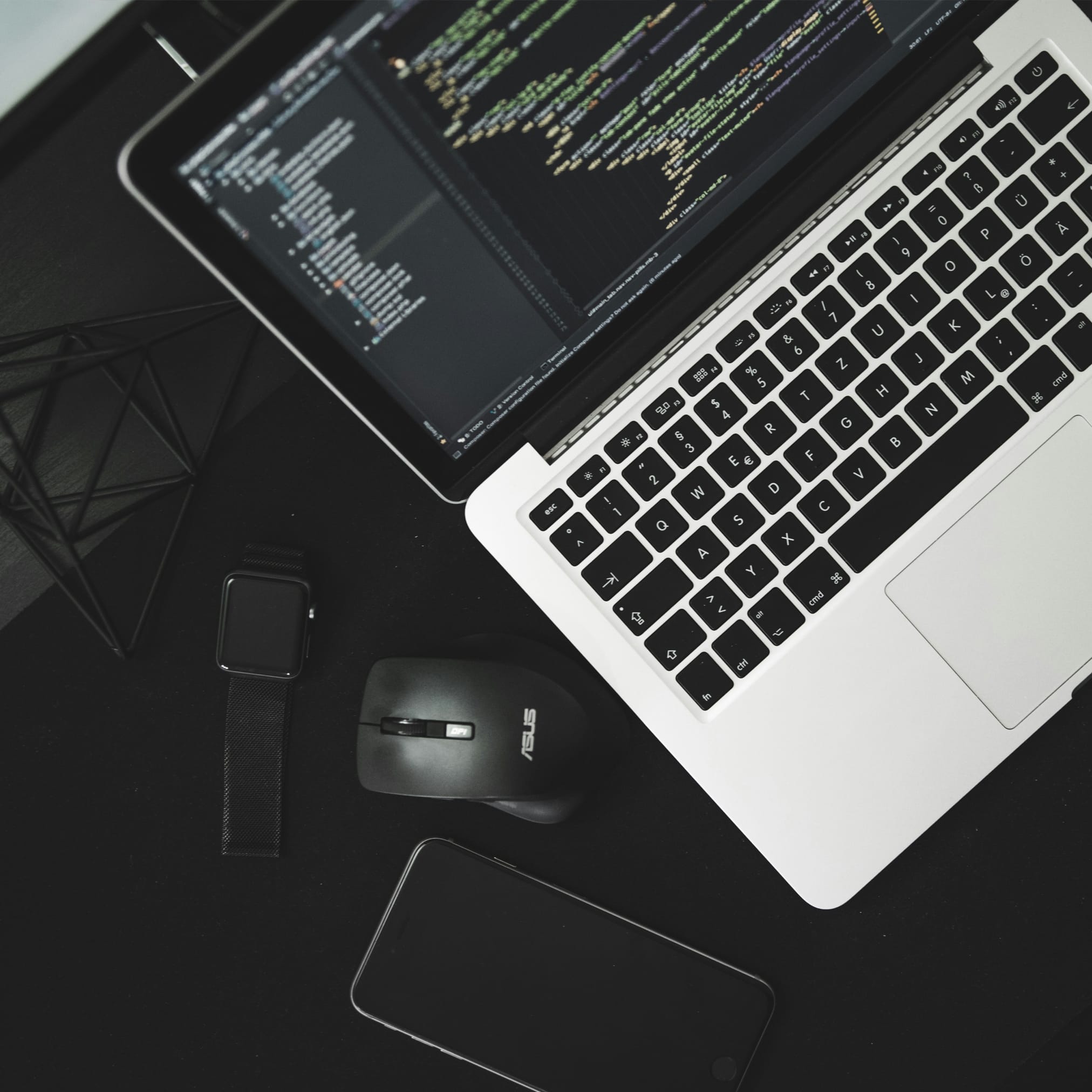 Two people looking at a tablet in a modern office.