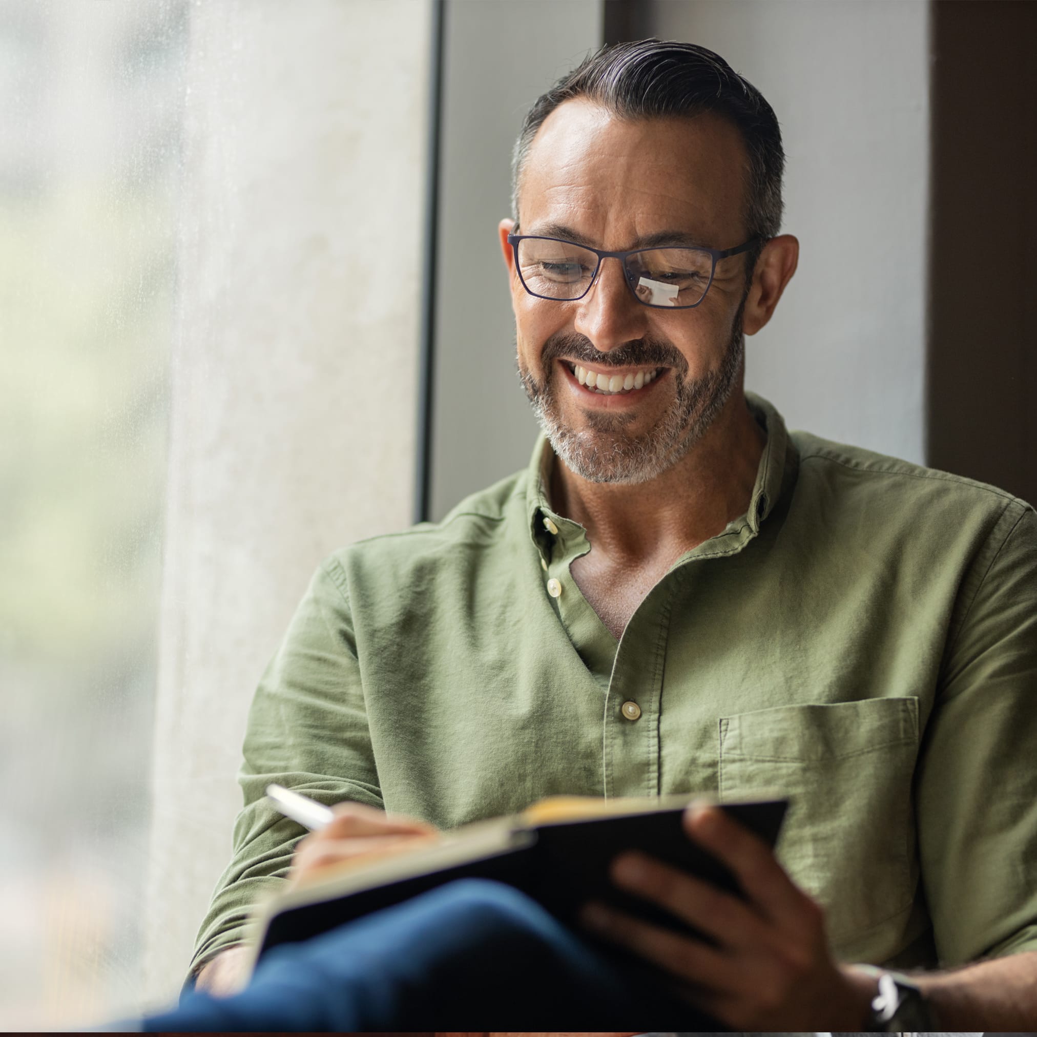 An architect working on a project at a desk.