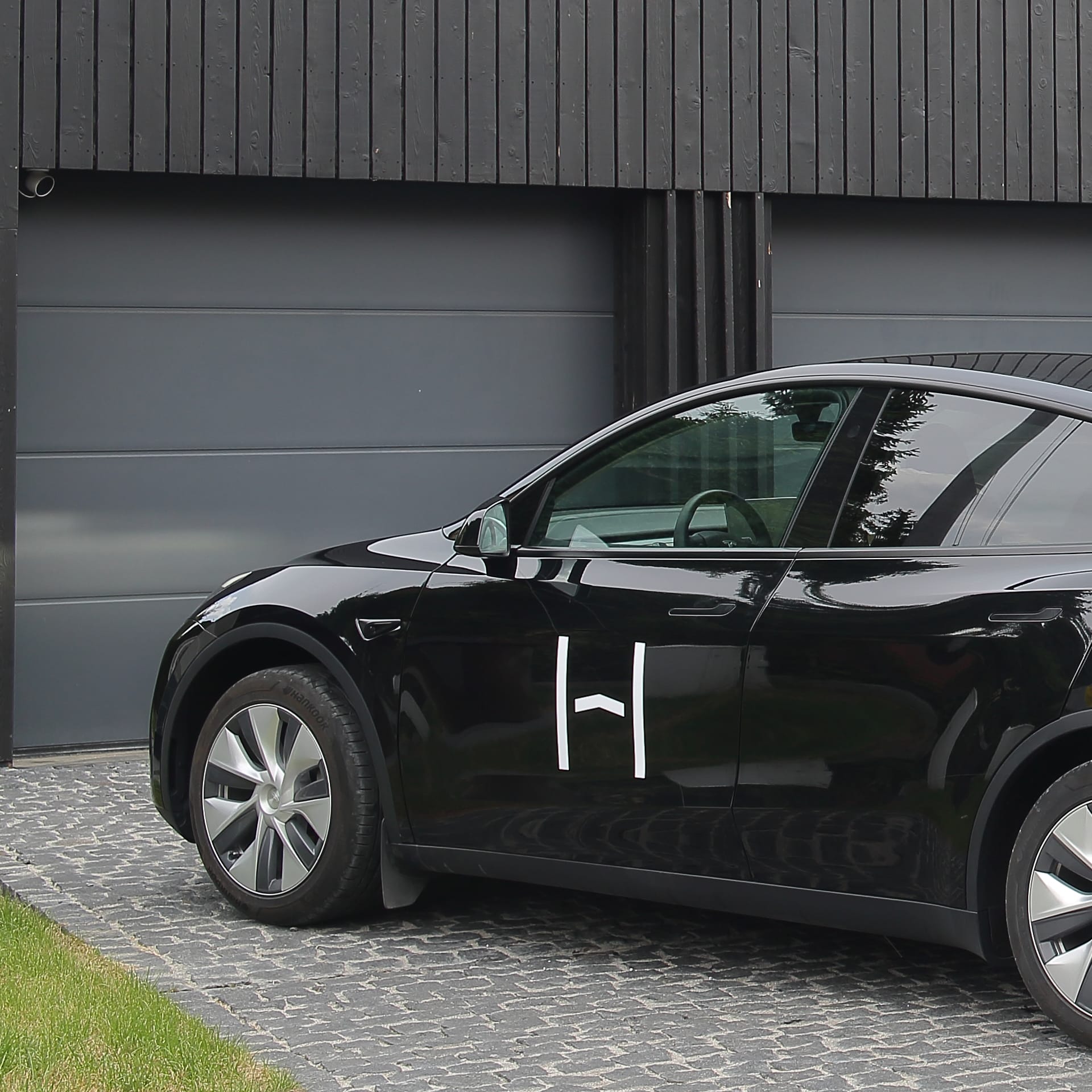 A man relaxing in an armchair in a modern living room
