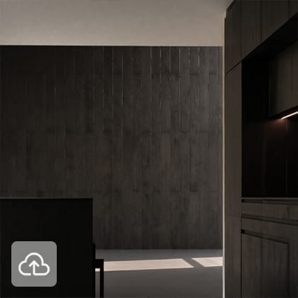 Minimalist interior with an empty floor and a wall covered with large, dark, matte tiles arranged vertically.